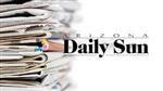 Arizona Daily Sun newspaper stack. 
